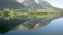 Blick über den See auf das Kaisergebirge