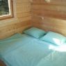 Schlafzimmer in einer 7-Personen-Blockhütte